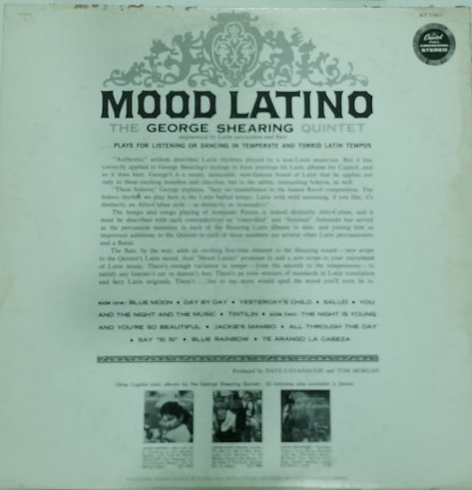 Back cover of a vinyl record featuring text and images of a music group.