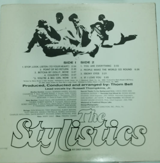 Back cover of a record with 'The Stylistics' text and track listing on a light green background