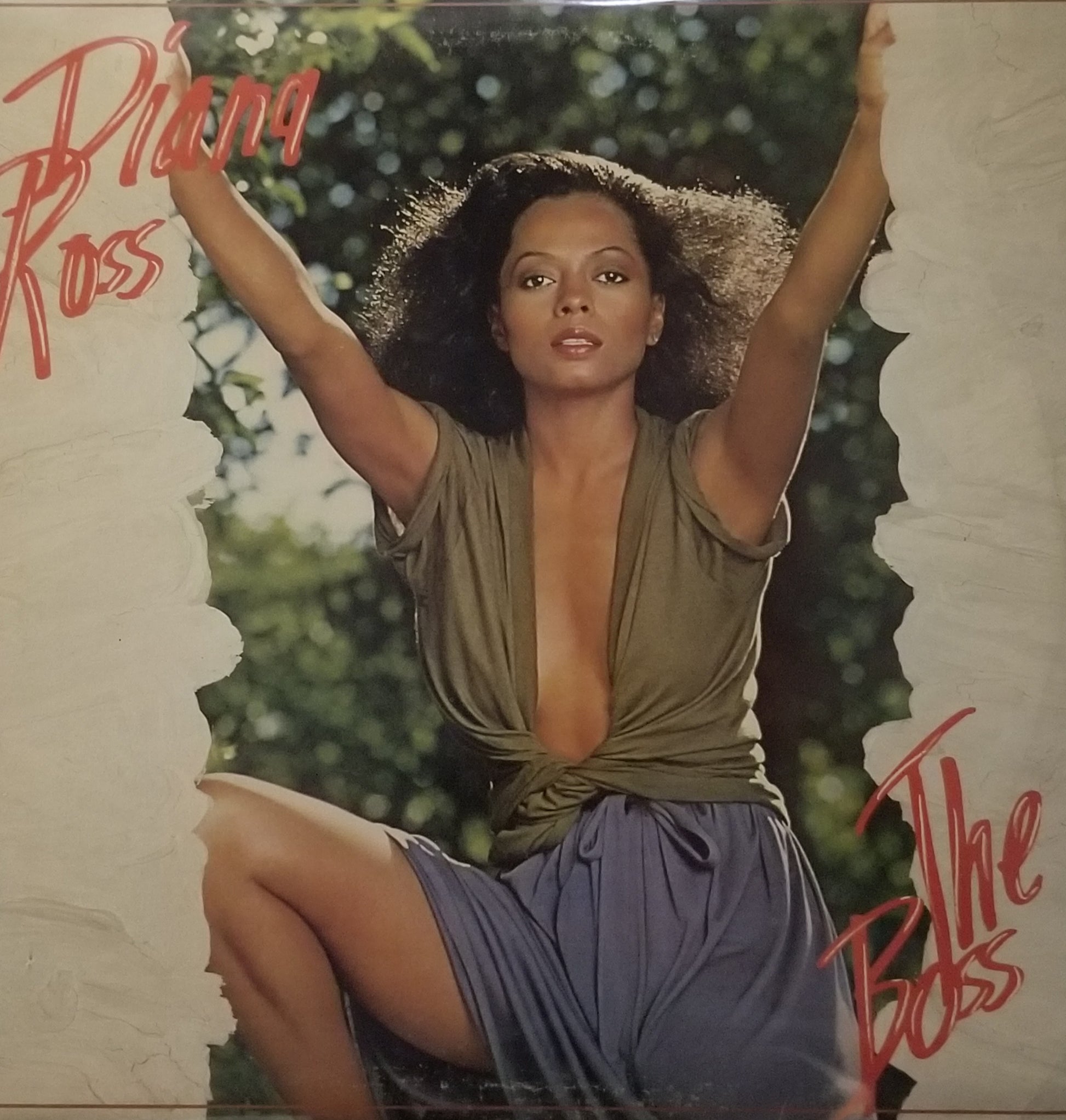 Album cover featuring a woman with her arms raised, with text 'Diana Ross' and 'The Bell's' on a decorative background.