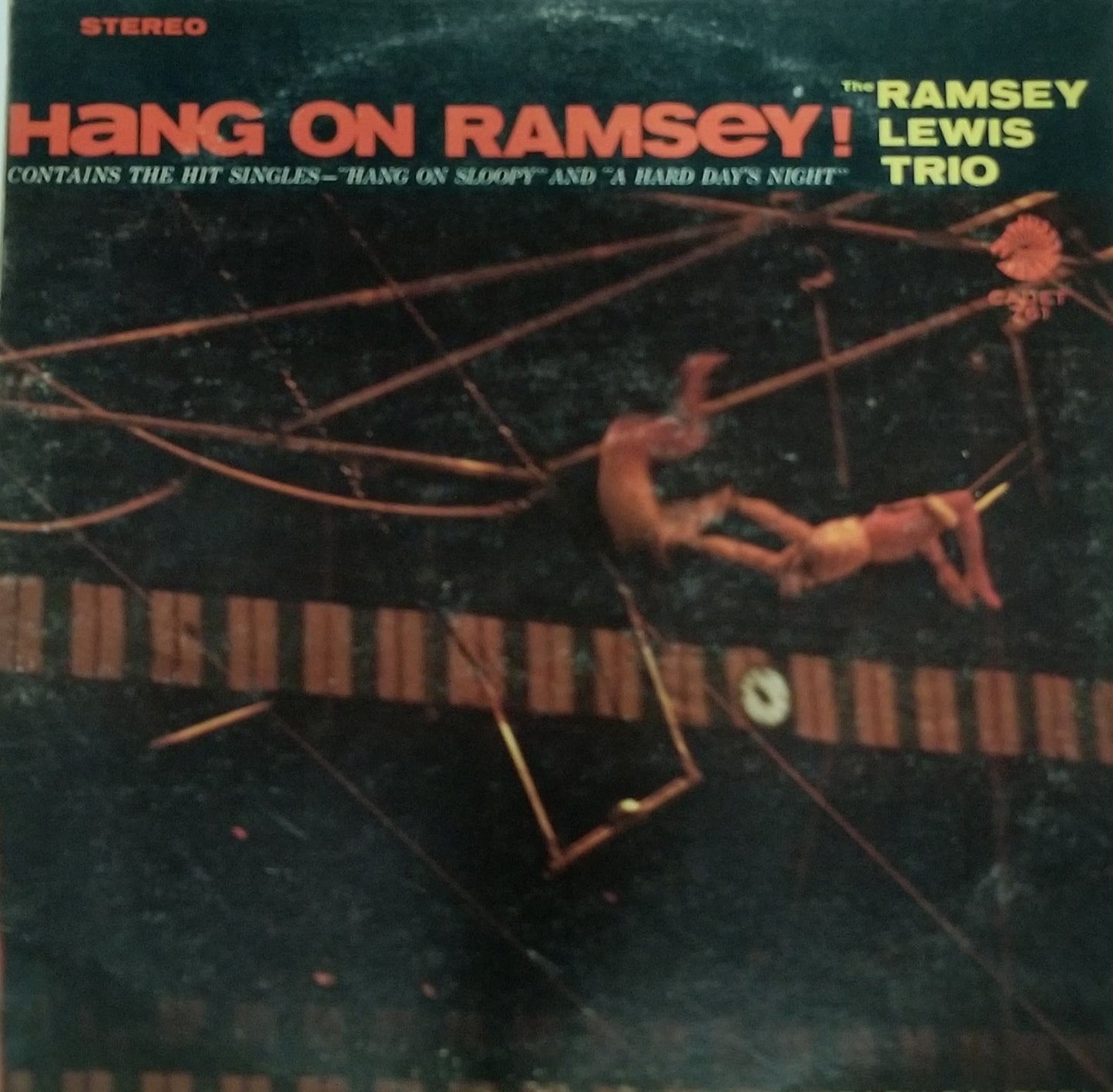 Album cover of 'Hang On Ramsey!' by The Ramsey Lewis Trio with a person on a trapeze.