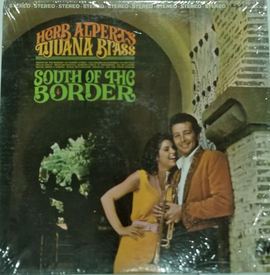 Vinyl record cover for Herb Alpert's Tijuana Brass' 'South of the Border' with a couple in front of an archway.