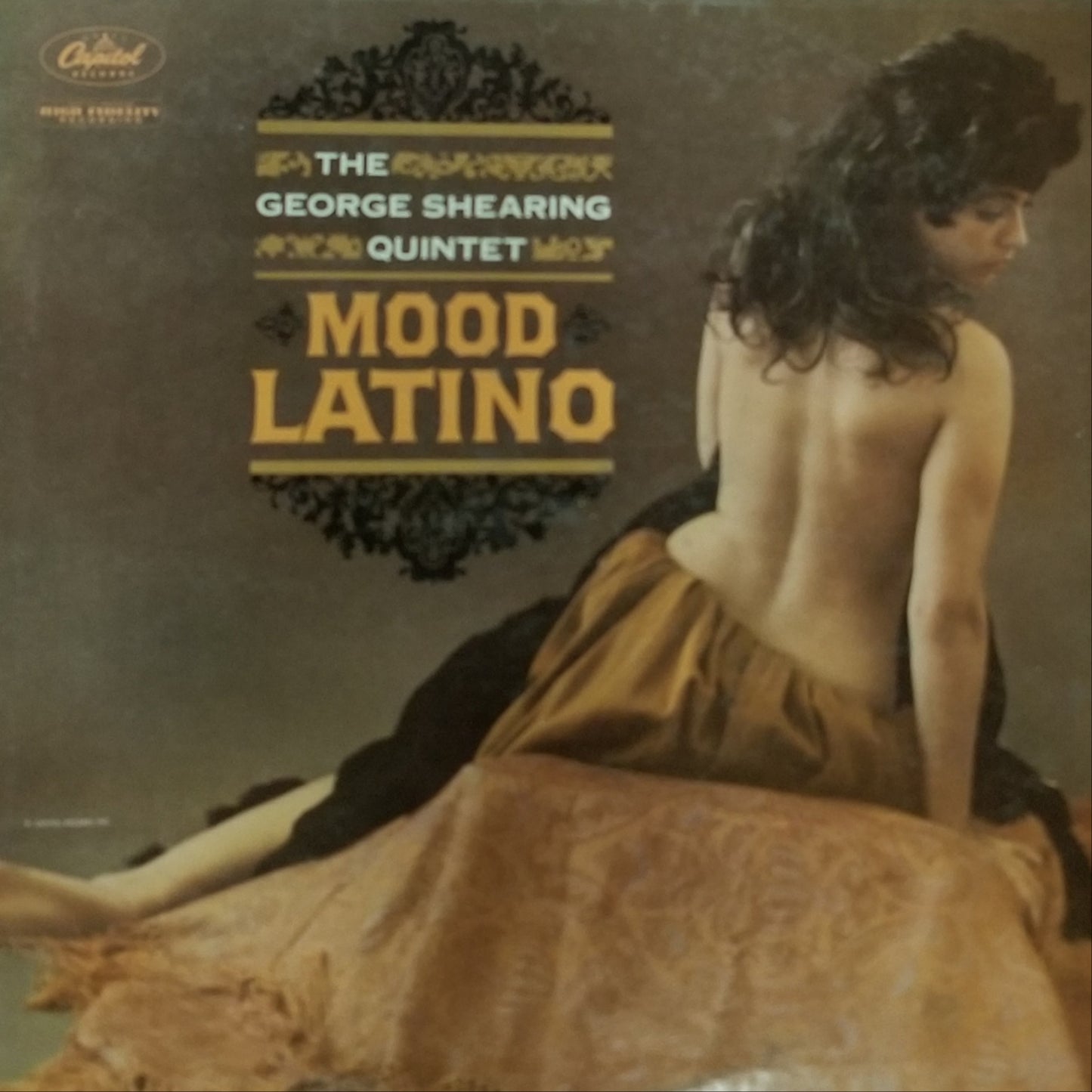 Album cover for 'Mood Latino' by The George Shearing Quintet with a woman sitting on a couch.
