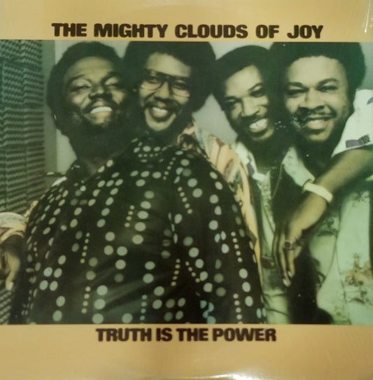 Album cover of 'The Mighty Clouds of Joy' with a group photo and text 'Truth is the Power'.